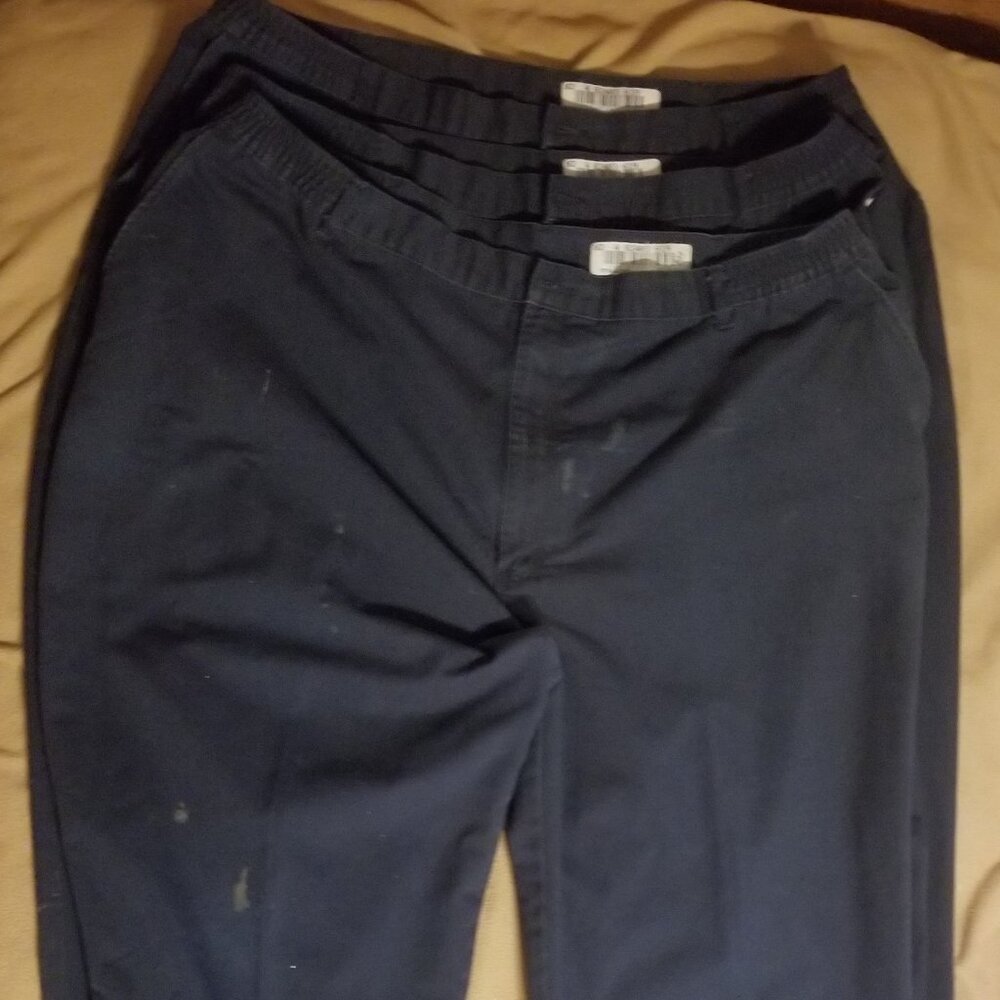 Three stained Cintas men's pants with stretching waistbands